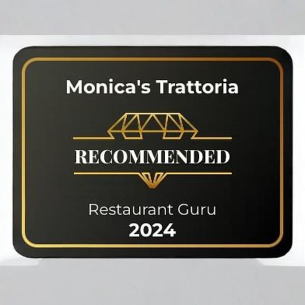 Monica's Trattoria Restaurant Guru Recommended 2024 award plaque, black with gold trim.