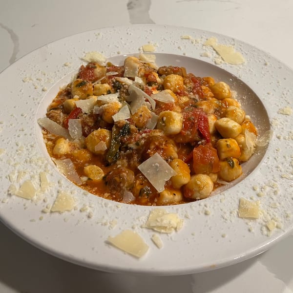 Monica's Trattoria gnocchi with tomato sauce, meat, and shaved Parmesan cheese.